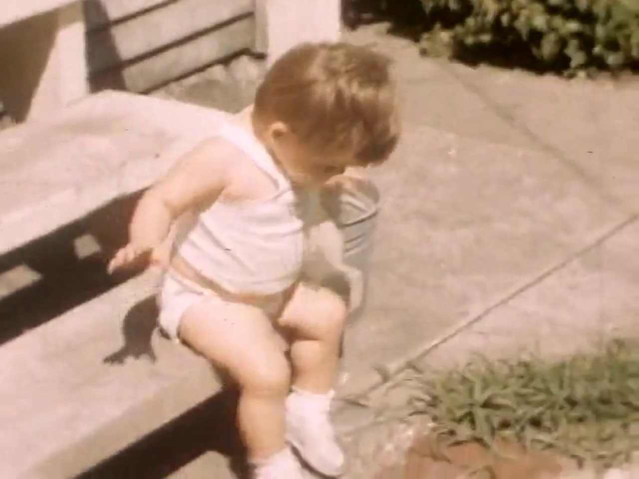 Original frame from the same 1952 film, soft and faded