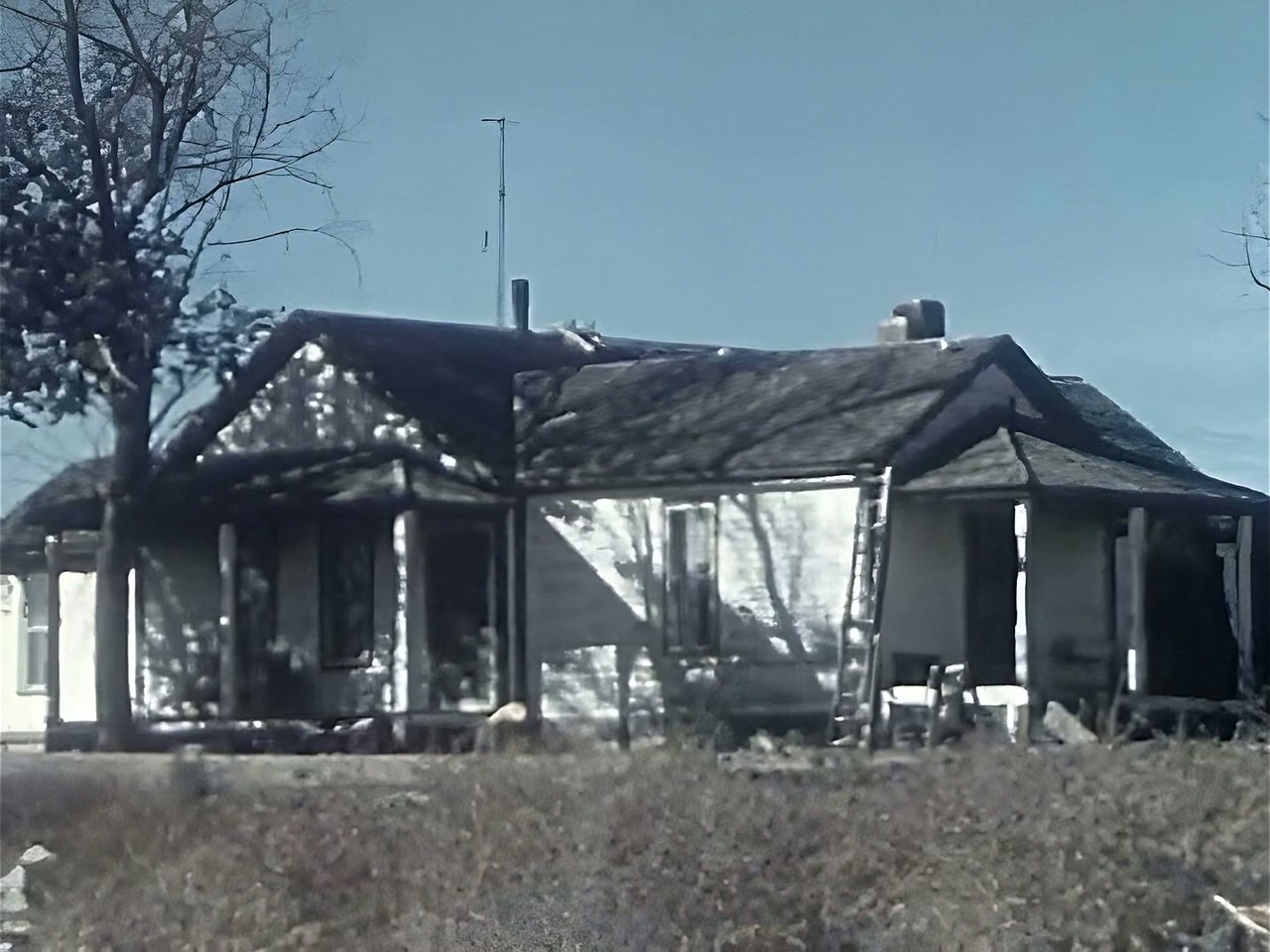 A farmhouse from a 1950s colour film, restored: crisp boards, clean sky